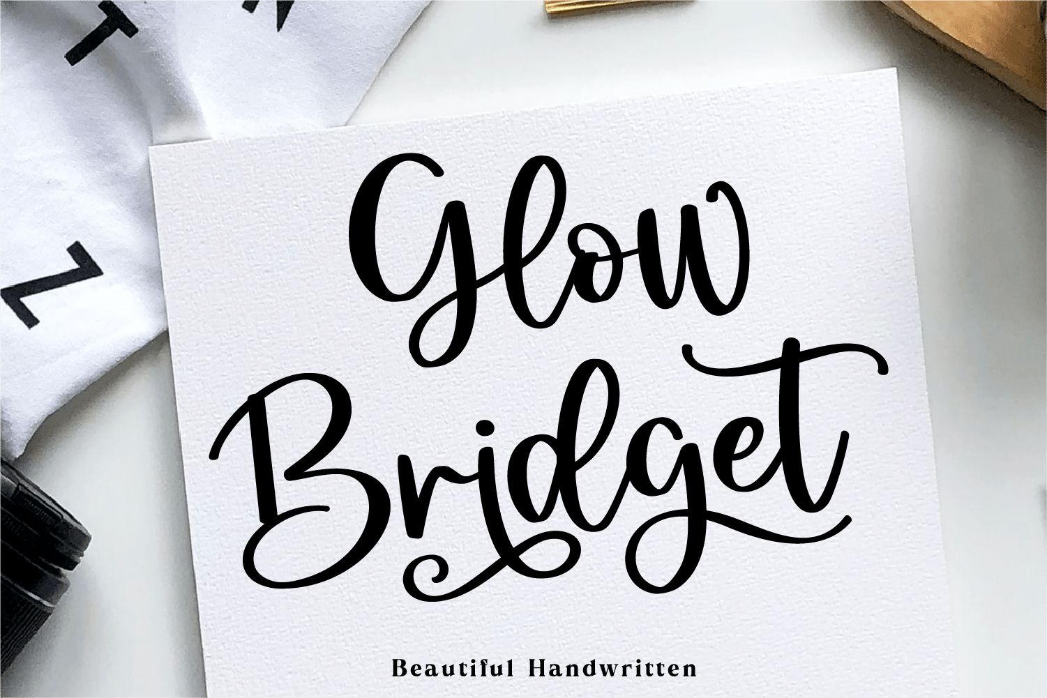 Glow Bridget Font by Figstype, bold bouncy handwriting on a paper card font preview