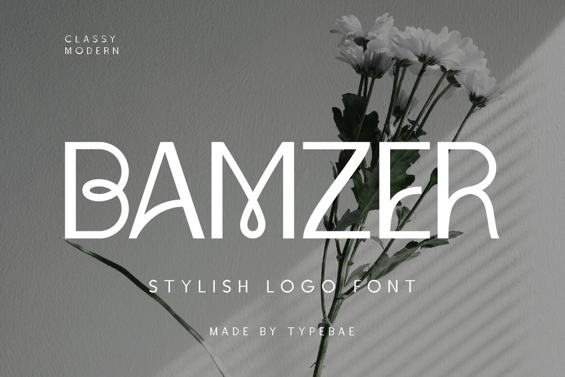 Bamzer Font by Typebae, narrow looped capitals over a black and white photo