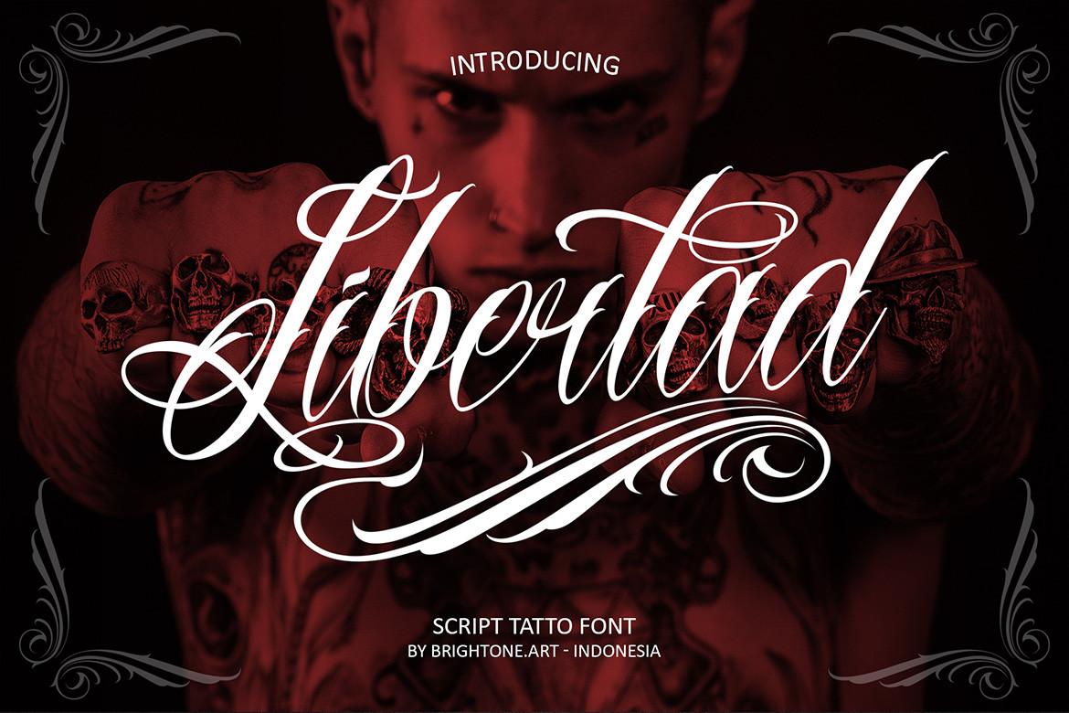 Libertad Font by brightonexart, white script tattoo font with long swashes on a dark red photo, tattoo font preview