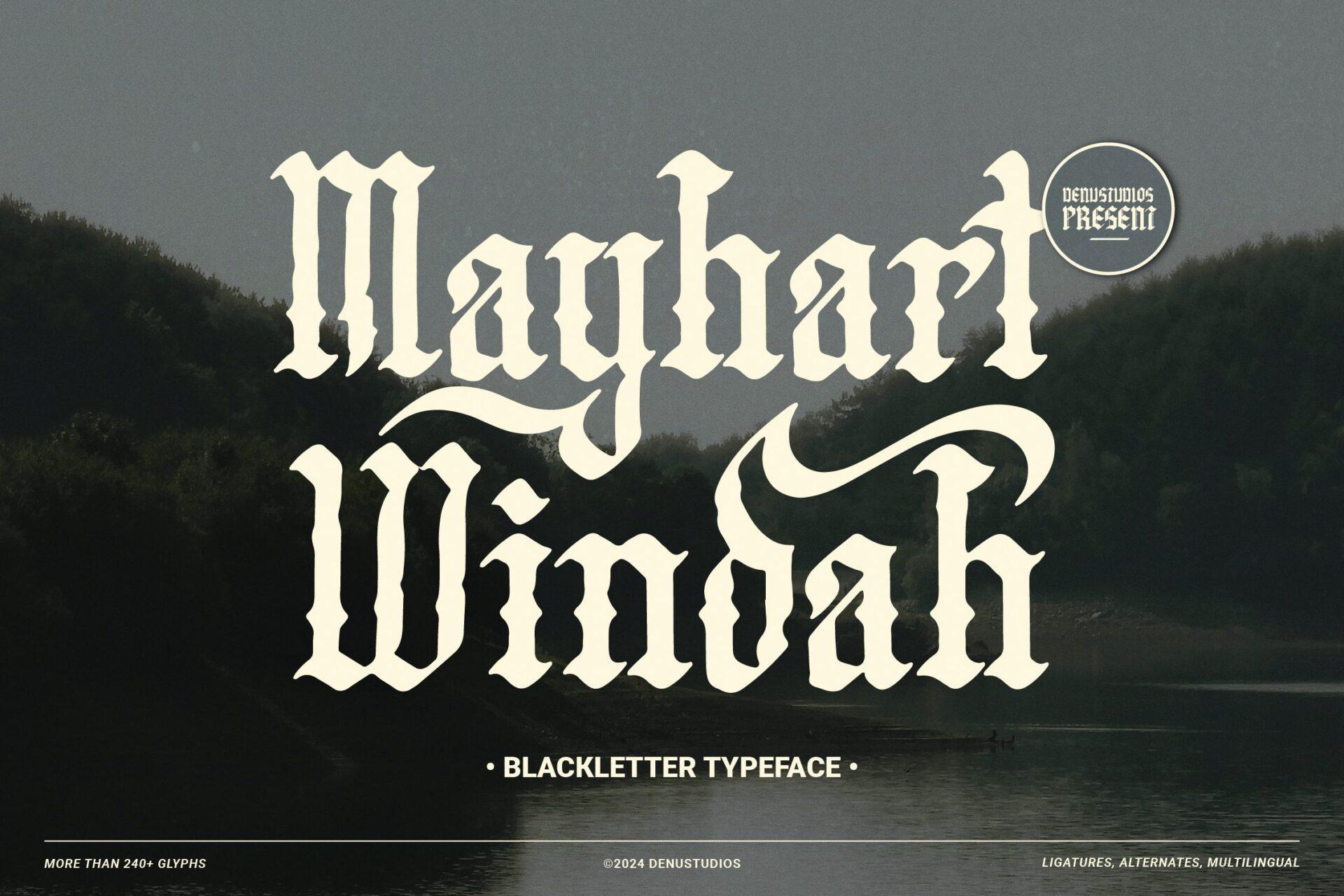 Mayhart Windah Font by Denustudios, tall cream blackletter with decorative capitals over a dark misty forest