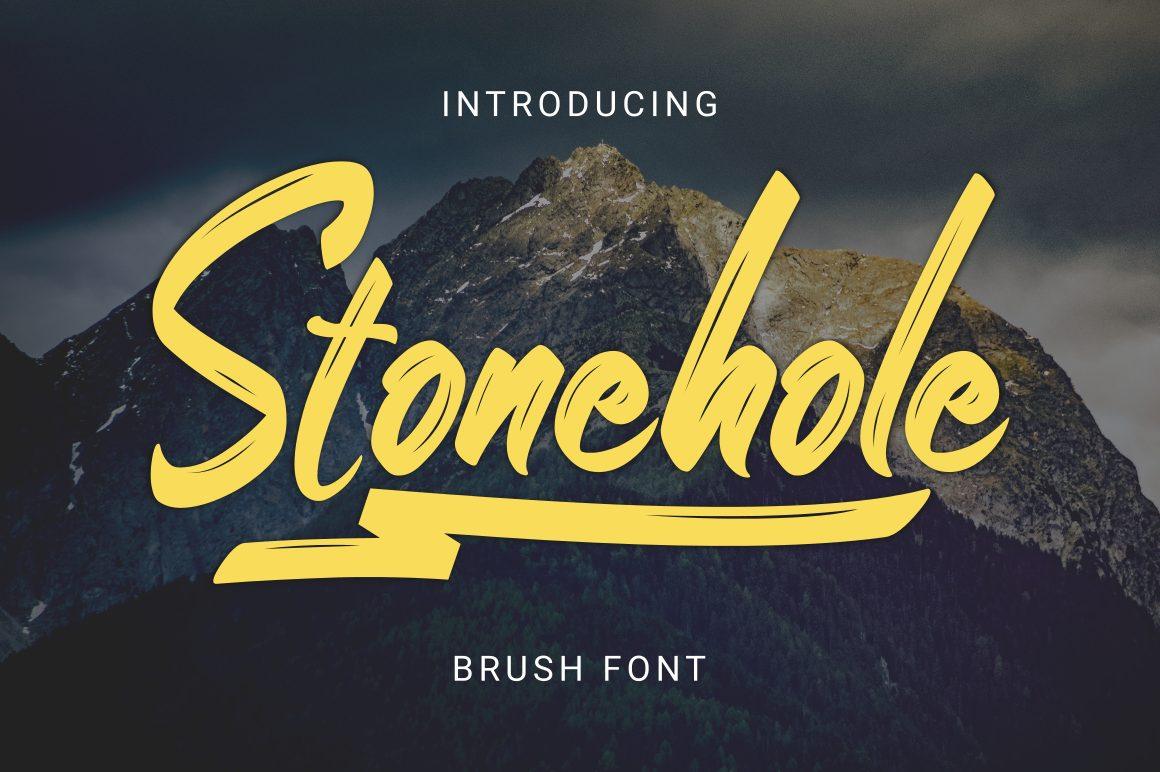 Stonehole Font by kammaqsum, bright yellow brush script with a long underline swash over a dark mountain photo